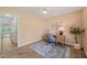 Comfortable office space with a view, featuring a wooden desk and neutral decor at 34 Johnston St, Pittsboro, NC 27312