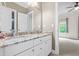 A spacious bathroom with a double vanity and granite countertops at 3821 Falls River Ave, Raleigh, NC 27614