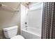 A bathroom with a shower/tub combo with white tiling at 3821 Falls River Ave, Raleigh, NC 27614
