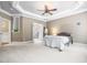 Spacious bedroom boasts a tray ceiling, a ceiling fan, and ample space for relaxation and personalization at 3821 Falls River Ave, Raleigh, NC 27614