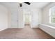 Bright bedroom offers neutral carpet, trim and paint and 3 doors at 3821 Falls River Ave, Raleigh, NC 27614