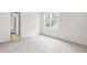 Bright bedroom with a window allowing natural light to illuminate the space at 3821 Falls River Ave, Raleigh, NC 27614