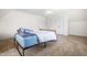 Upstairs bedroom featuring carpeted floors, two closets, and a ceiling fan at 3821 Falls River Ave, Raleigh, NC 27614