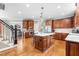 Gourmet kitchen featuring granite countertops, custom cabinets and a center island at 3821 Falls River Ave, Raleigh, NC 27614