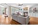 Comfortable living room with a fireplace, built-in shelving and hardwood floors at 3821 Falls River Ave, Raleigh, NC 27614