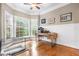 Office featuring wood floors, natural light from windows, and desk at 3821 Falls River Ave, Raleigh, NC 27614