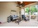 Relaxing screened-in patio with seating, ceiling fan and wood ceiling at 3821 Falls River Ave, Raleigh, NC 27614