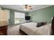 Cozy bedroom featuring natural lighting, carpeted floors and a wooden dresser at 4022 Avents Ferry Rd, Sanford, NC 27330
