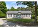 Charming single-story home with a well-manicured lawn and inviting front porch at 4022 Avents Ferry Rd, Sanford, NC 27330
