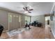 Open-concept living area with hardwood floors and an exercise bike at 4022 Avents Ferry Rd, Sanford, NC 27330