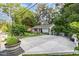 Charming home features a beautiful yard, unique water feature, mature trees and an extra wide driveway at 414 Madison Ave, Cary, NC 27513