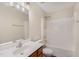 Bathroom with a wood vanity, white countertops, and shower-tub combo at 430 Dogwood Creek Pl, Fuquay Varina, NC 27526