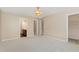 Spacious bedroom featuring plush carpeting and multiple entryways into closet and bathroom at 430 Dogwood Creek Pl, Fuquay Varina, NC 27526