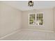 An empty bedroom with neutral paint, carpet, and one window at 430 Dogwood Creek Pl, Fuquay Varina, NC 27526