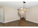 Dining room with laminate floors and designer light fixture at 430 Dogwood Creek Pl, Fuquay Varina, NC 27526