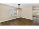 Dining room with laminate floors, designer light fixture, and sunlit windows at 430 Dogwood Creek Pl, Fuquay Varina, NC 27526