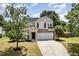 Charming two-story home with stone accents, a well-maintained lawn, and a spacious two-car garage at 430 Dogwood Creek Pl, Fuquay Varina, NC 27526