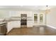 Contemporary kitchen features stainless steel appliances, granite countertops, and ample cabinet space at 430 Dogwood Creek Pl, Fuquay Varina, NC 27526