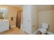 Bathroom with a single vanity, toilet, and shower, offering essential amenities in a compact space at 4667 Freedom Dr, Burlington, NC 27215