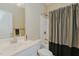 Well-lit bathroom featuring a shower/tub combination and a vanity with a white countertop at 4667 Freedom Dr, Burlington, NC 27215