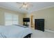 Inviting bedroom boasts a ceiling fan, window, and comfortable decor for a relaxing retreat at 4667 Freedom Dr, Burlington, NC 27215