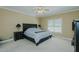 Relaxing bedroom offers a ceiling fan and window, perfect for a peaceful night's sleep at 4667 Freedom Dr, Burlington, NC 27215