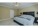 Spacious bedroom showcases a ceiling fan and window, creating a comfortable and inviting space at 4667 Freedom Dr, Burlington, NC 27215