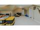 Open bonus room provides ample room for furniture and storage, with a door and a television at 4667 Freedom Dr, Burlington, NC 27215
