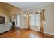 An open dining area with hardwood floors and a fireplace offers lots of natural light at 4667 Freedom Dr, Burlington, NC 27215