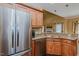Stainless steel appliances complement the granite countertops and wood cabinets of the kitchen at 4667 Freedom Dr, Burlington, NC 27215