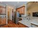 A kitchen displays granite countertops, wooden cabinets, and stainless steel appliances at 4667 Freedom Dr, Burlington, NC 27215