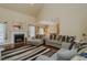 Inviting living room with fireplace and neutral walls, seamlessly connects to kitchen and dining area at 4667 Freedom Dr, Burlington, NC 27215
