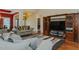 Open concept living room featuring a large TV, fireplace and seating, perfect for entertaining at 4667 Freedom Dr, Burlington, NC 27215