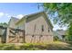 Fenced backyard with lawn, brick foundation, and vinyl siding at 48 Arlington Dr, Cameron, NC 28326