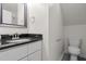 Bathroom featuring granite countertop, modern fixtures, and a toilet at 48 Arlington Dr, Cameron, NC 28326