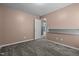Carpeted bedroom with an open doorway, offering a bright and airy atmosphere at 48 Arlington Dr, Cameron, NC 28326