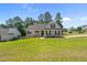 Charming two-story home with well-maintained lawn and traditional brick and siding exterior at 48 Arlington Dr, Cameron, NC 28326