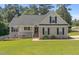 Charming single Gathering home featuring a lush green lawn, and a welcoming porch perfect for relaxing at 48 Arlington Dr, Cameron, NC 28326