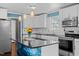Bright kitchen featuring white cabinets, granite countertops, a backsplash, and stainless appliances at 48 Arlington Dr, Cameron, NC 28326