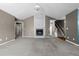 A spacious living room featuring plush carpeting and a cozy fireplace perfect for relaxing and entertaining guests at 48 Arlington Dr, Cameron, NC 28326