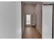 Finished attic space with hardwood flooring, a built-in shelf, and ample storage, offering a versatile and functional area at 4921 Sweetbriar Dr, Raleigh, NC 27609