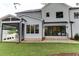 Backyard view of home's exterior and screened in porch with outdoor kitchen at 4921 Sweetbriar Dr, Raleigh, NC 27609