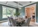 Elegant dining room featuring a coffered ceiling, modern lighting, and a large window at 4921 Sweetbriar Dr, Raleigh, NC 27609
