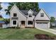 Charming, two-story brick home with a well-manicured lawn and inviting curb appeal at 4921 Sweetbriar Dr, Raleigh, NC 27609