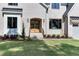 Close-up of a bright brick home with a dark roof and well-manicured landscaping at 4921 Sweetbriar Dr, Raleigh, NC 27609