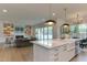 Open-concept kitchen with a view to the living room and a modern design at 4921 Sweetbriar Dr, Raleigh, NC 27609