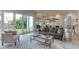Spacious living room with a wall of glass doors to enjoy the backyard views at 4921 Sweetbriar Dr, Raleigh, NC 27609