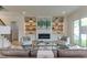 Cozy living room featuring a fireplace, built-in shelving, and comfortable seating at 4921 Sweetbriar Dr, Raleigh, NC 27609