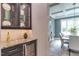 View of the pantry area with granite countertops and a wine cooler at 4921 Sweetbriar Dr, Raleigh, NC 27609