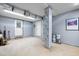 Unfinished basement space, ready for customization, with painted walls and multiple doors at 5208 Melbourne Rd, Raleigh, NC 27606